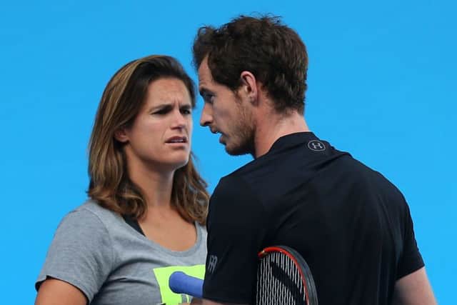 Andy Murray and Amelie Mauresmo during a practice session ahead of the Australian Open final. Picture: Getty
