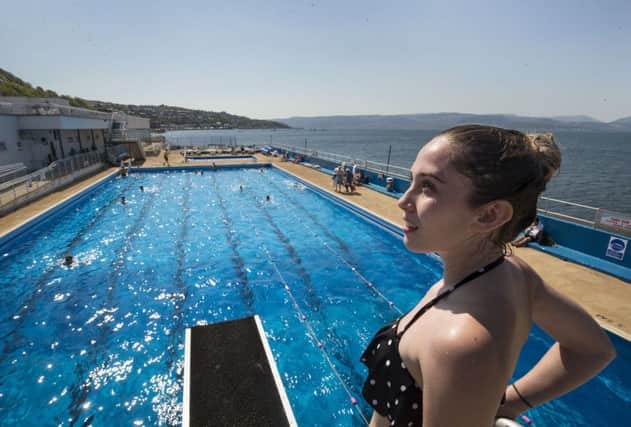Swimmers and sunbathers enjoy the hot weather at Gourock Outdoor Pool. Picture: PA