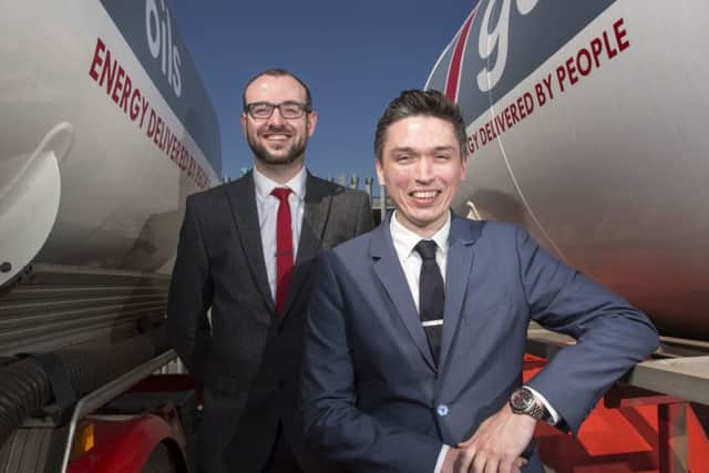 Johnston Fuels is introducing online tools to help its customers and Craig Fulton, marketing manager, right, and Stephen Wilkins, IT operations manager, are involved in developing them. Picture: Ian Rutherford