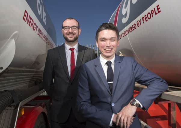 Johnston Fuels is introducing online tools to help its customers and Craig Fulton, marketing manager, right, and Stephen Wilkins, IT operations manager, are involved in developing them. Picture: Ian Rutherford