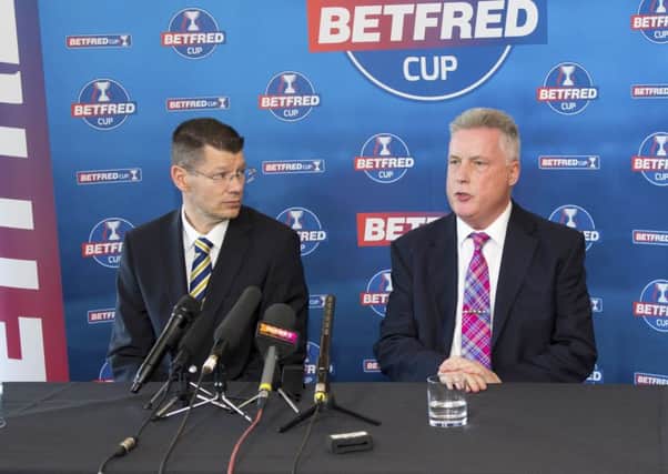 SPFL chief Neil Doncaster, left, with Betfreds John Haddock. All three major club competitions are now sponsored by bookmakers. Picture: SNS