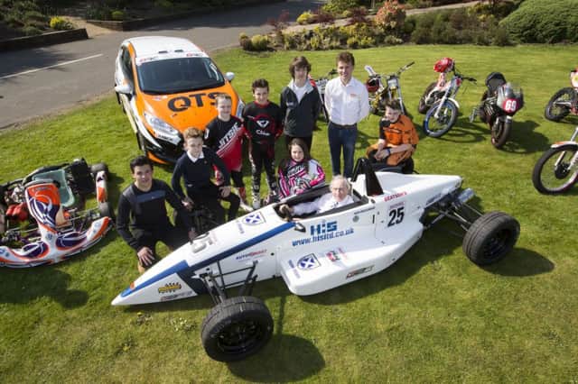Formula 1 great Sir Jackie Stewart, centre, and other Scottish motorsport stars, club members and representatives of sportscotland and Scottish Motor Sport. Picture: PA