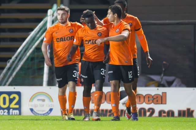 Dundee United's Justin Johnson (33) celebrates after he scores his side's late equaliser. Picture: Kenny Smith/SNS