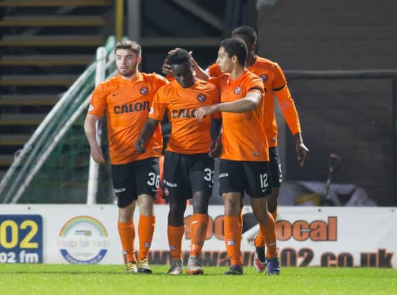 Dundee United's Justin Johnson (33) celebrates after he scores his side's late equaliser. Picture: Kenny Smith/SNS