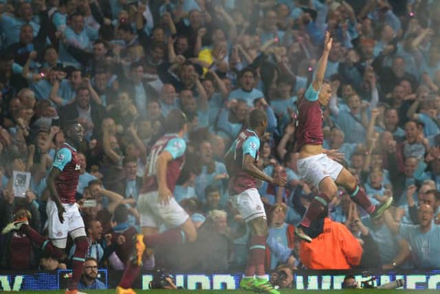 West Ham defender Winston Reid, right, celebrates after scoring the winning goal against Manchester United in the Hammers final match at their spiritual home. Picture: AFP/Getty