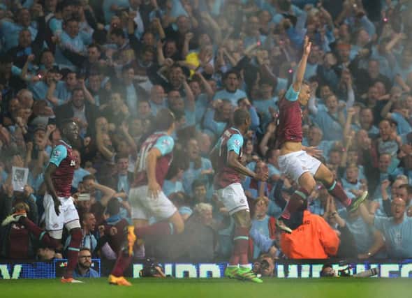 West Ham defender Winston Reid, right, celebrates after scoring the winning goal against Manchester United in the Hammers final match at their spiritual home. Picture: AFP/Getty