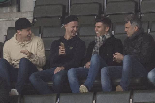 Celtic's Leigh Griffiths (centre left) was in attendance at Easter Road last night. Picture: SNS