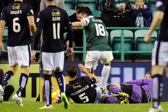 David McCracken makes a sliding challenge, seconds before the handball. Picture: Michael Gillen