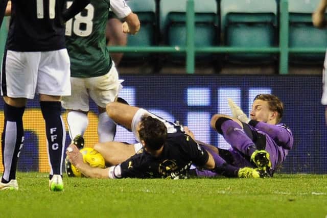 Falkirk defender David McCracken handles the ball in the box as he goes to ground against Hibs at Easter Road. Picture: Michael Gillen