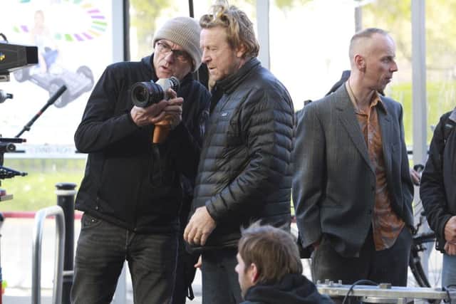 Ewan Bremner (right) who plays Spud with Danny Boyle (left) on set filming the sequel to Trainspotting in Muirhouse.