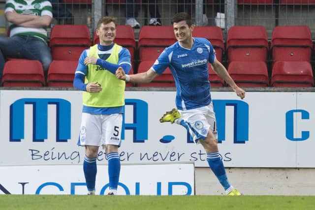 St Johnstone substitute Graham Cummins celebrates his winner against champions Celtic at McDiarmid Park last night. Picture: SNS