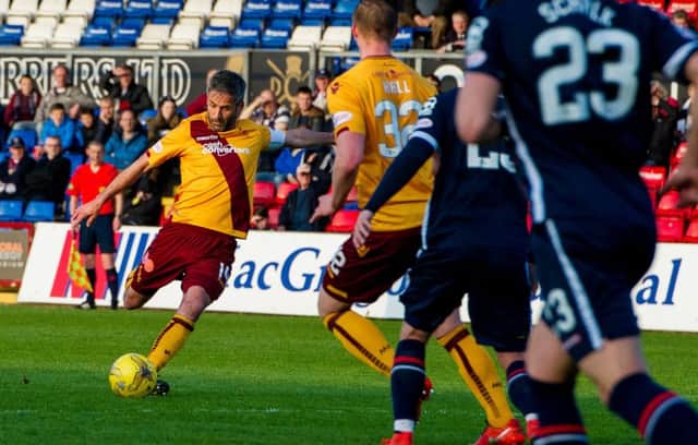 Motherwell's Keith Lasley doubles the lead for his side. Picture: SNS