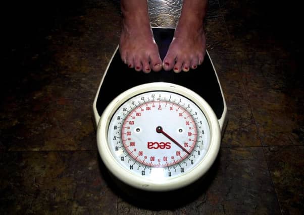 Dundee resident Claire Campbell lost over 50 pounds in seven months, and recommends eating from smaller plates to trick yourself into thinking your portion sizes are larger. Picture: Esme Allen