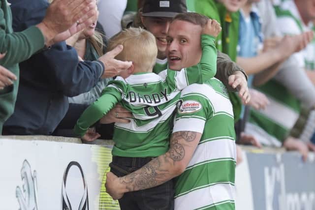 Celtic's Leigh Griffiths celebrates scoring his 40th goal of the season with his son. Picture: SNS