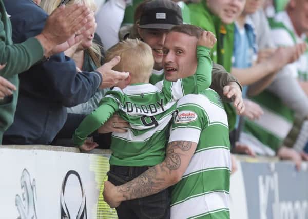 Celtic's Leigh Griffiths celebrates scoring his 40th goal of the season with his son. Picture: SNS