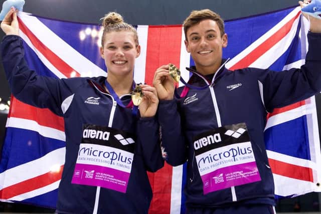 Great Britain's Tom Daley and Grace Reid celebrate with their gold medals after winning the 3m Synchro Diving Mixed final at the European Aquatics Championships in London. Picture: John Walton/PA Wire