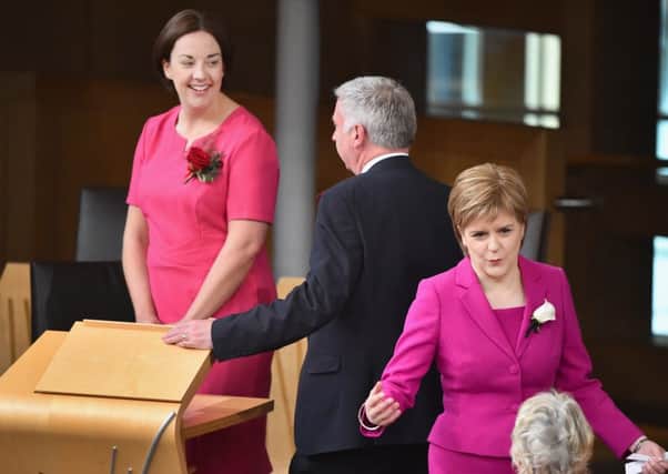 Nicola Sturgeon and Kezia Dugdale during yesterday's swearing in ceremony. Picture: Getty