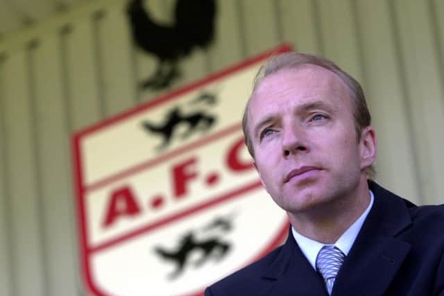 The Airdrieonians badge and former manager Steve Archibald. Picture Allan Milligan