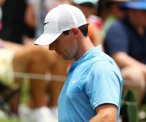 Rory McIlroy walks off the ninth green after squandering his chance to shoot a course record 62 at Sawgrass. Picture: Getty Images