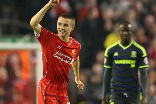 Rossiter celebrates scoring the opening goal during the Capital One Cup Third Round match between Liverpool and Middlesbrough in 2014. Picture: Getty
