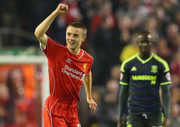 Rossiter celebrates scoring the opening goal during the Capital One Cup Third Round match between Liverpool and Middlesbrough in 2014. Picture: Getty