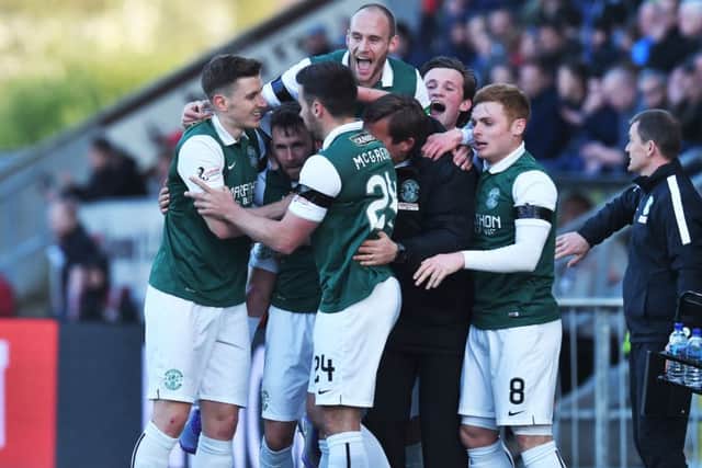 Keatings celebrates with his team-mates after scoring his side's second goal. Picture: SNS