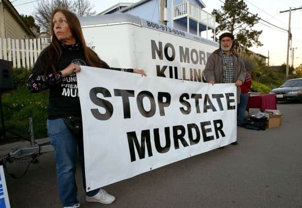 Opponents of the death penalty outside California State Prison in 2004. Photograph: Justin Sullivan/Getty