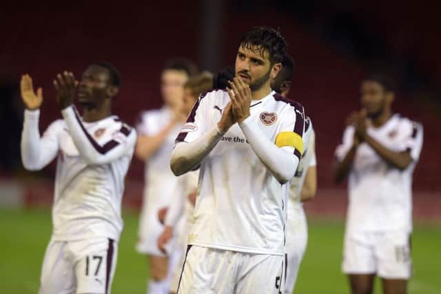 Hearts' Alim Ozturk applauds the fans. Picture: SNS