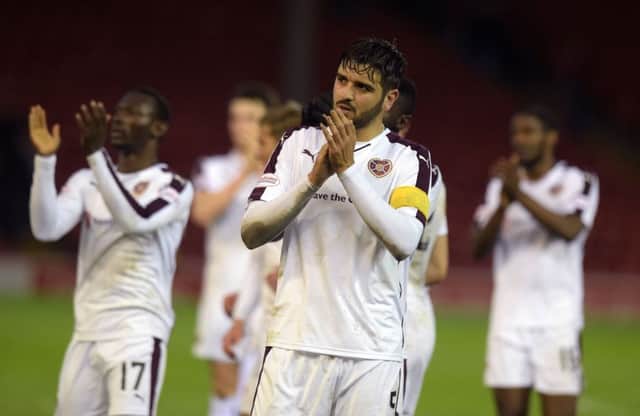 Hearts' Alim Ozturk applauds the fans. Picture: SNS