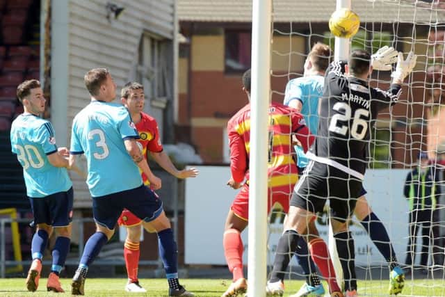 Kris Doolan (third from left) opens the scoring for Partick Thistle. Picture: Craig Williamson, SNS Group
