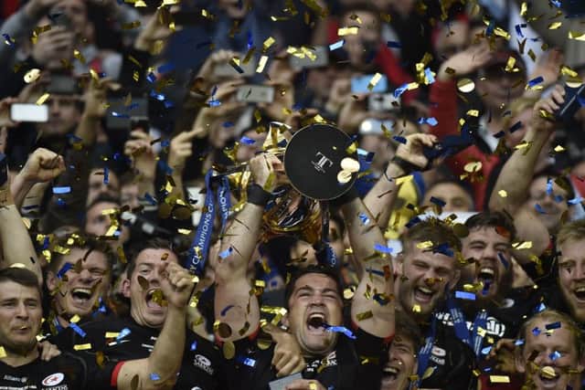 Saracens players celebrate with the trophy after winning the European Champions Cup final at the Parc Olympique Lyonnais. Picture: AFP/Getty Images