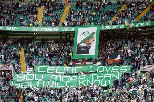 Home fans unveil a banner at Celtic Park. Picture: Danny Lawson/PA