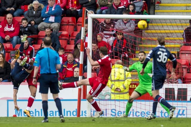 Ross County's Alex Schalk (partially blocked on left) scores to make it 2-0. Picture: SNS