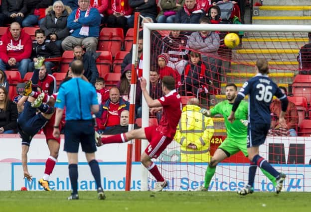 Ross County's Alex Schalk (partially blocked on left) scores to make it 2-0. Picture: SNS