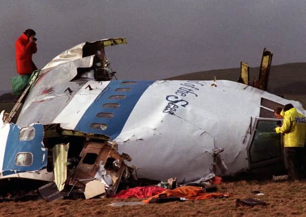 The remains of the flight deck of Pan Am 103 on a field in Lockerbie. Picture: AP