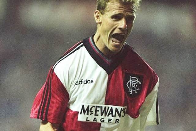 Gordon Durie celebrates a goal while wearing the original red and white quartered away kit. Picture: Getty Images