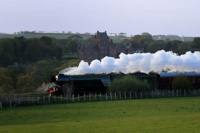 The Flying Scotsman passes Ayton Castle on the East Coast mainline on route to Edinburgh. Picture: Kimberley Powell