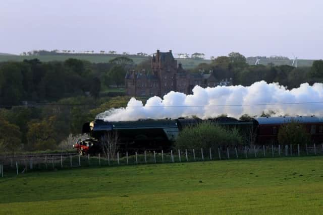 The Flying Scotsman passes Ayton Castle on the East Coast mainline on route to Edinburgh. Picture: Kimberley Powell