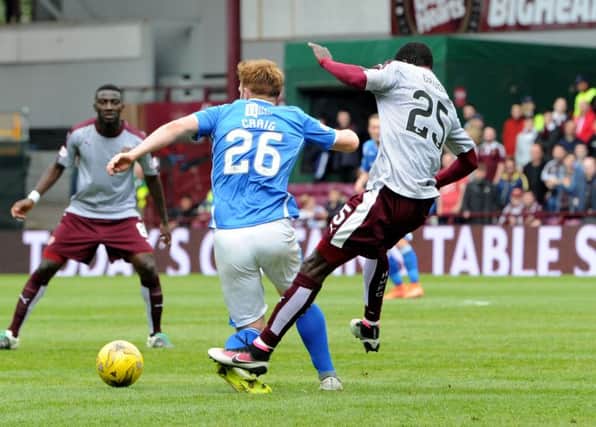 Hearts' Abiola Dauda was shown a red card for this challenge on St Johnstone's Liam Craig. Picture: SNS