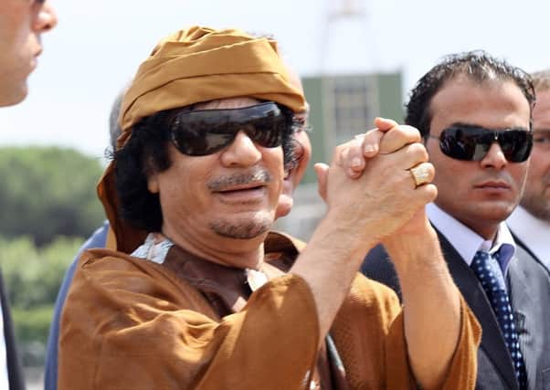 Colonel Muammar al-Gaddafis aide is accused of investing embezzled funds in Scotland. Picture: Getty Images