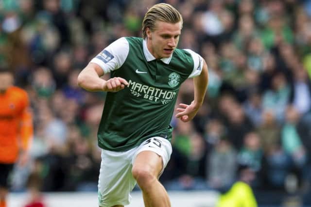 Jason Cummings has had to prove more than most players that he wants to do well for Hibs. Picture: SNS
