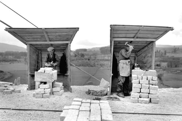 Kemnay Quarries. Aberdeenshire. Sett-makers working in their individual huts, or  scathies. PIC: British Geological Survey/NERC