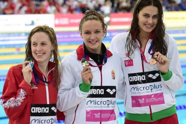 Hannah Miley, left, with Hungarian pair Katinka Hosszu, centre, and Zsuzsanna Jakabos. Picture: Leon Neal/AFP/Getty