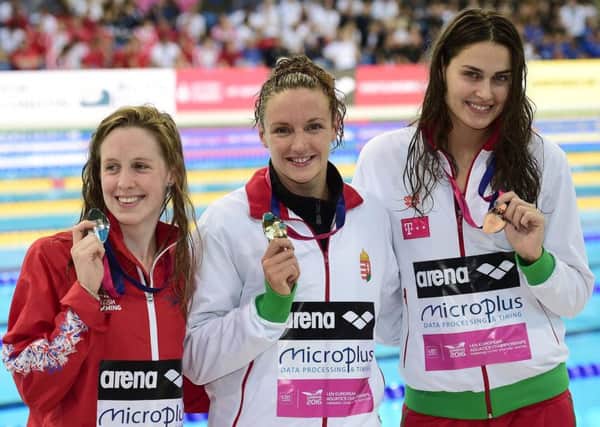 Hannah Miley, left, with Hungarian pair Katinka Hosszu, centre, and Zsuzsanna Jakabos. Picture: Leon Neal/AFP/Getty