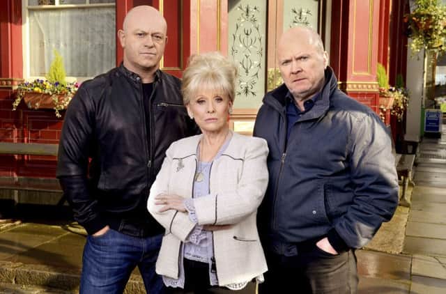 Peggy Mitchell (Dame Barbara Windsor) with on-screen sons Grant and Phil. Picture: PA/BBC