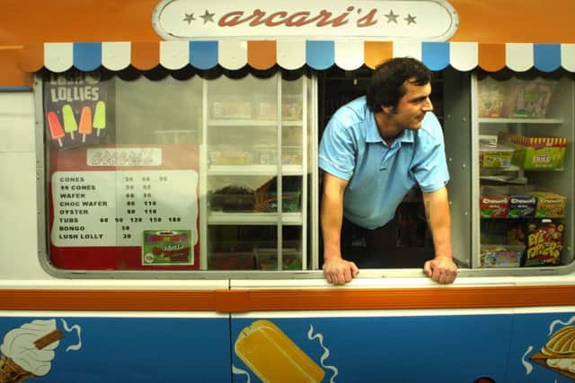 Arcari's ice cream. Michael Acari looks from the window of his ice cream van in 2004.