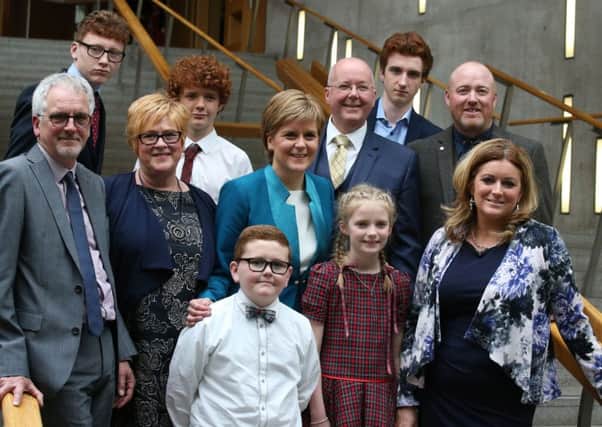 Nicola Sturgeon stands with family members after she was voted in as the First Minister. Picture: PA