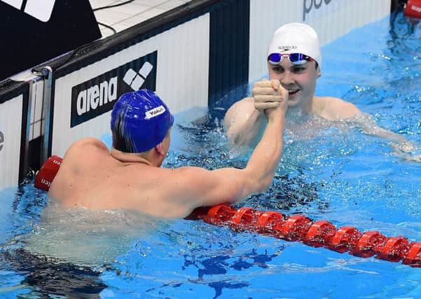 Adam Peaty, left, and Ross Murdoch congratulate one another after the 100m breaststroke final at the London Aquatic Centre. Picture: Leon Neal/AFP/Getty