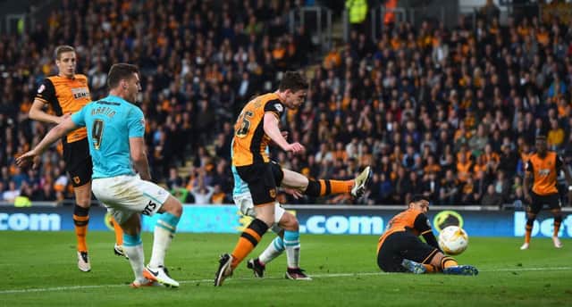 Hull defender Andy Robertson scores an own goal during the Championship play-off semi-final second leg match against Derby. Picture: Laurence Griffiths/Getty Images
