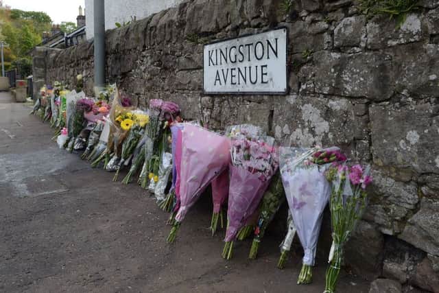 Floral tributes on Kingston Avenue. Picture: Neil Hanna